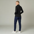 Ashtown Clothing women's black performance full zip medical jacket with back pocket, worn by a model from behind.