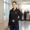 Ashtown Clothing women's black performance full-zip medical jacket with custom heart embroidery in a hospital setting