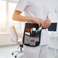 Ashtown Clothing black medical utility waist organizer pouch worn by a nurse with tools in pockets in a clinic