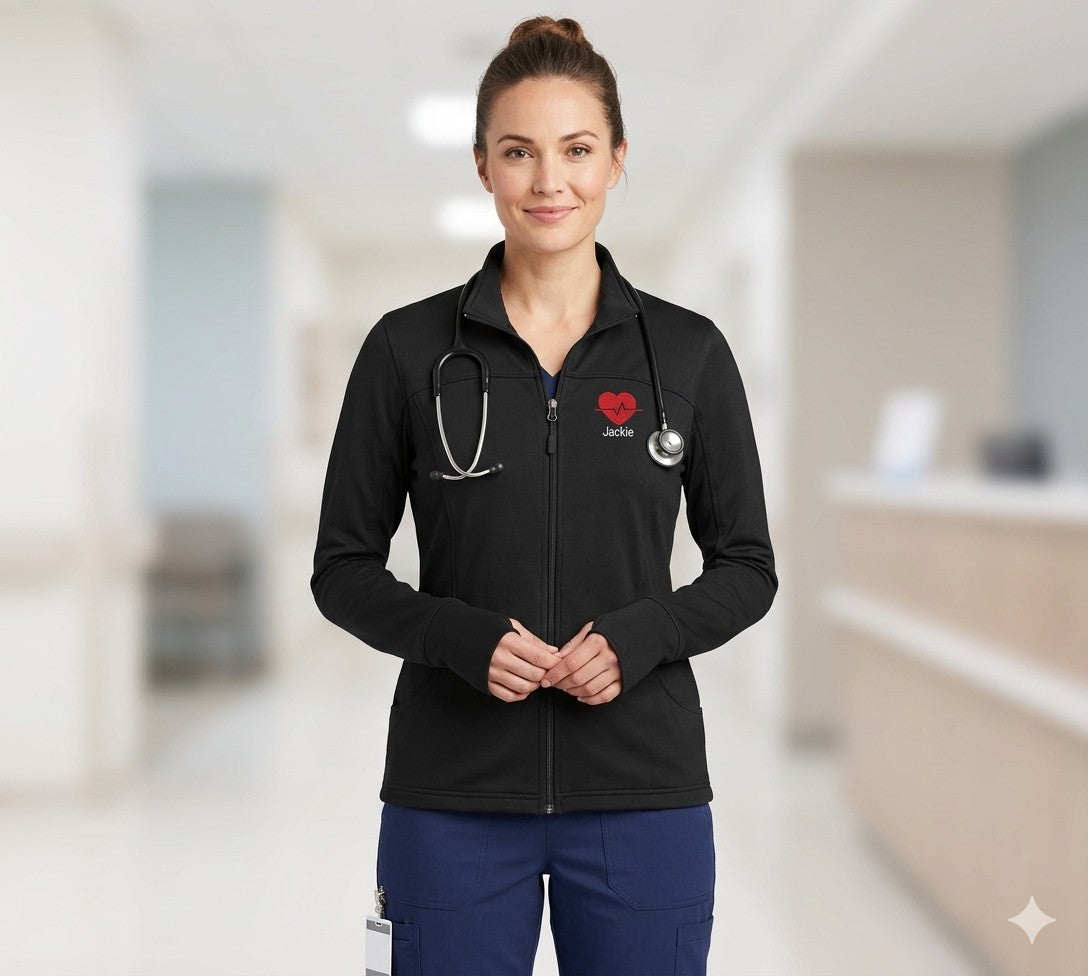 Ashtown Clothing women's black performance full-zip medical jacket with thumbholes and custom heart embroidery