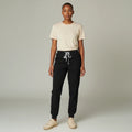 Ashtown Clothing women's black petite performance scrub joggers with a drawstring waist and tapered ribbed cuffs.