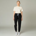 Ashtown Clothing women's black petite performance scrub jogger pants with a drawstring waist and tapered ribbed cuffs.