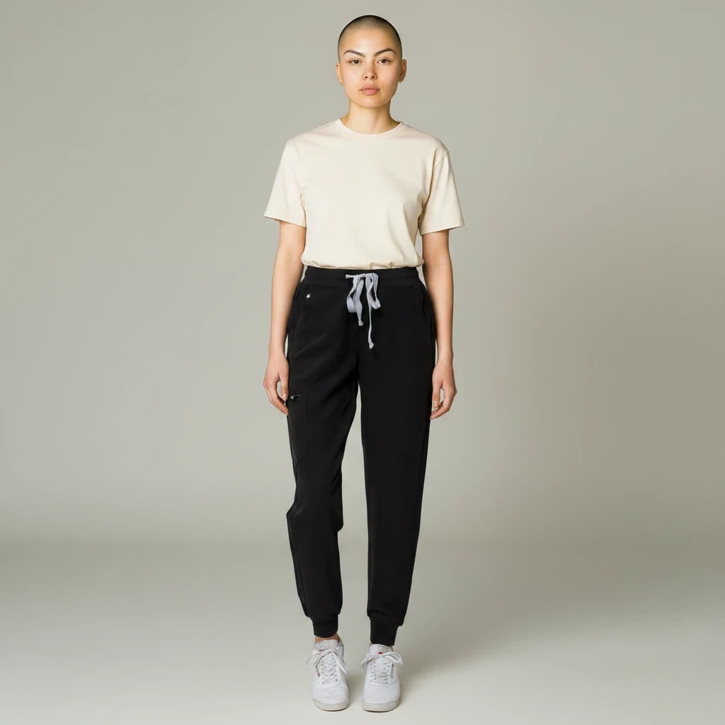 Ashtown Clothing women's black petite performance scrub jogger pants with a drawstring waist and tapered ribbed cuffs.