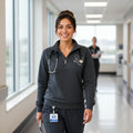 Ashtown Clothing unisex charcoal grey quarter zip fleece pullover with custom medical embroidery worn by a nurse