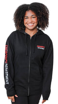 Ashtown Clothing black unisex zip-up hoodie with Emergency Department branding on the chest and sleeve worn by a woman