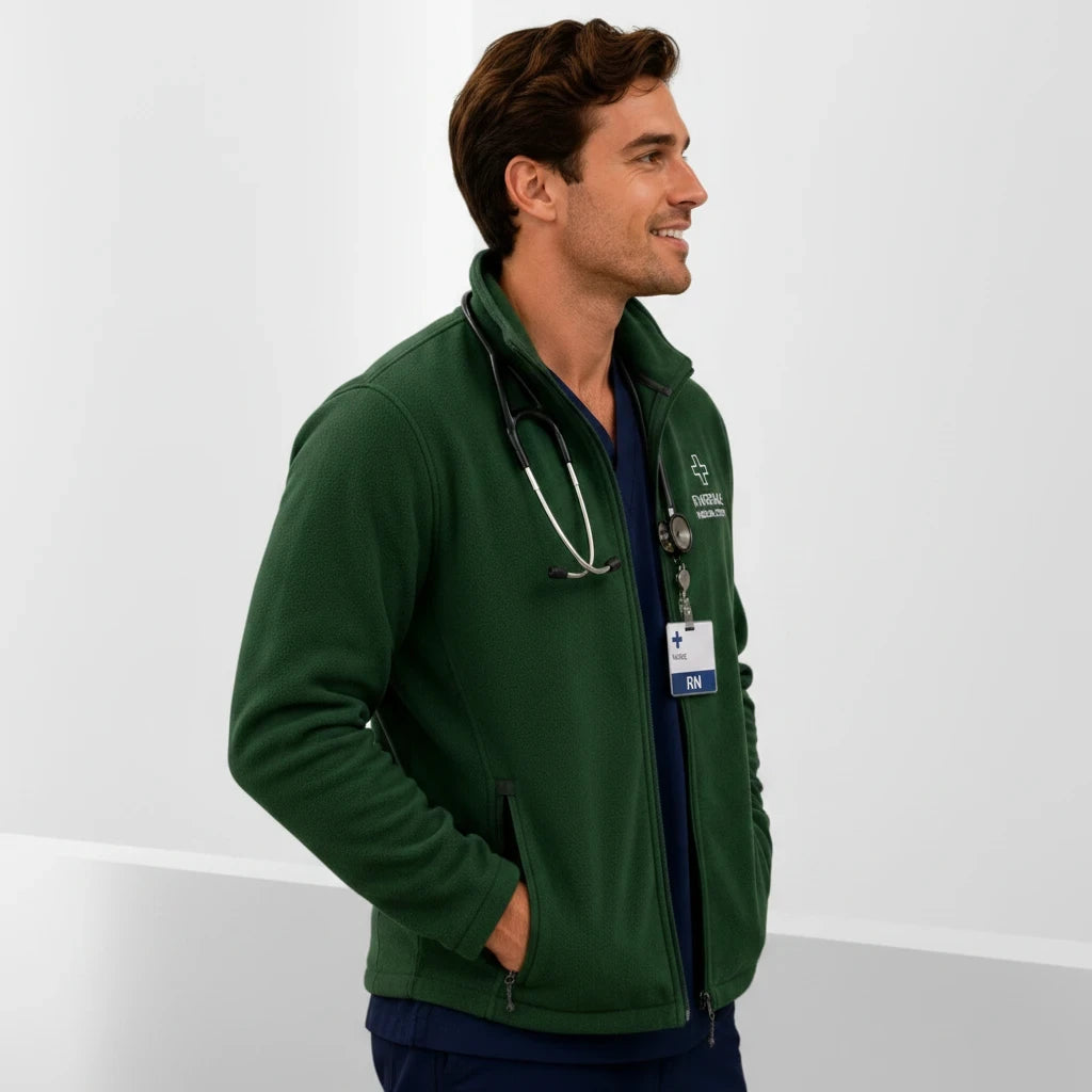 Ashtown Clothing dark green full zip fleece medical jacket worn by a male nurse with a stethoscope in a studio.